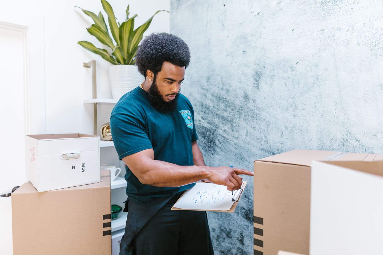 Vantage mover checking a packing inventory list